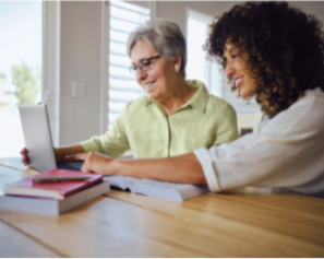 Two people view a computer screen